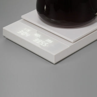 HARIO Polaris Coffee Scale in white with acrylic surface and illuminated digital display showing weight and time