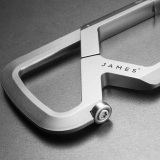 Close-up of silver anodized aluminum James The Mehlville Carabiner with visible screw and smooth finish by The James Brand