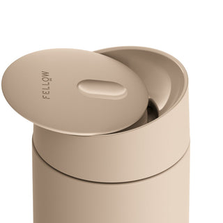 FELLOW Carter Slide Replacement Lid in beige BPA-free plastic with smooth matte finish on mug top