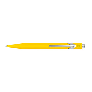 Caran d'Ache 849 Classic Line Ballpoint Pen in yellow hexagonal aluminum body with chrome clip