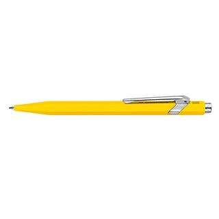 Caran d'Ache 849 Classic Line Ballpoint Pen in yellow with hexagonal aluminum body and chrome clip