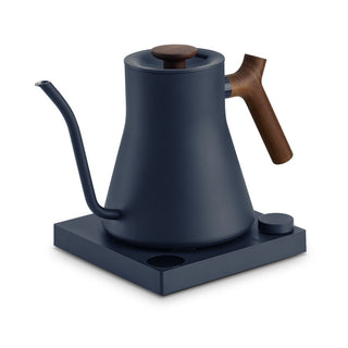Fellow Stagg EKG Pro Electric Pour Over Kettle (120V) matte navy with wooden handle on charging base