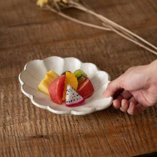 Kaneko Kohyo - Small Plate - White - Rinka Series - hand holding scalloped porcelain plate with fresh fruit slices