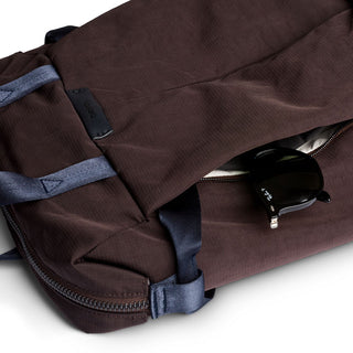 Bellroy Tokyo Totepack Compact in brown fabric with hidden zip pocket holding black sunglasses