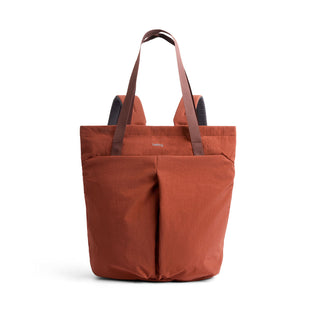 Bellroy Lite Totepack in burnt orange recycled fabric with front pockets and shoulder straps visible
