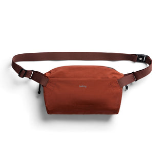 Bellroy Lite Sling in burnt orange with adjustable strap made from water-resistant recycled materials