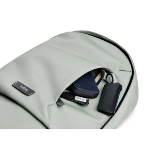 Bellroy Classic Backpack Second Edition in soft gray with front pocket holding wallet and keys