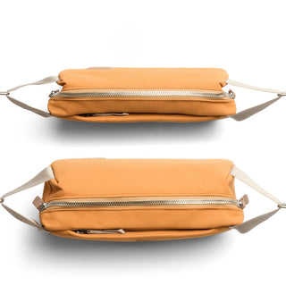 Bellroy Classic Sling 3L in tan with silver zipper and cream adjustable strap shown from top and bottom angles