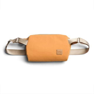 Bellroy Classic Sling 3L in orange recycled fabric with adjustable beige strap and leather logo patch