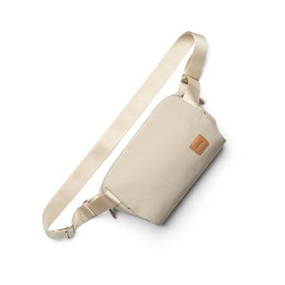 Bellroy Classic Sling 3L in beige with recycled fabric and leather patch detail