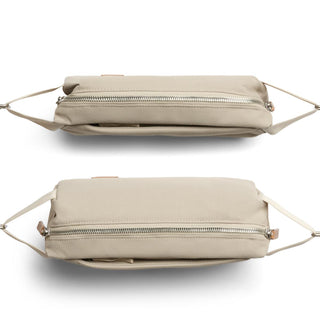 Bellroy Classic Sling 3L in beige showing top and bottom views with visible zipper and fabric texture