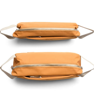 Bellroy Classic Sling 5L in tan recycled fabric with silver zipper and adjustable strap details