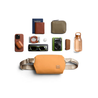 Bellroy Classic Sling 5L in warm tan with adjustable straps and smooth recycled fabric texture