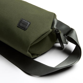 Bellroy Classic Sling 5L in olive green recycled fabric with adjustable strap and leather logo patch
