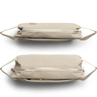 Bellroy Classic Sling 5L in beige with dual zipper closures and smooth recycled fabric texture