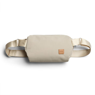 Bellroy Classic Sling 5L in beige with smooth recycled fabric and leather logo patch detail