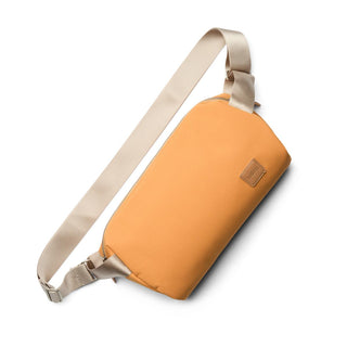 Bellroy Classic Sling 7L in tan with beige adjustable strap and recycled fabric construction