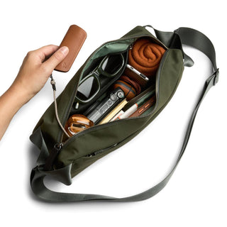 Bellroy Classic Sling 7L in olive green with organized compartments and adjustable shoulder strap