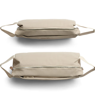 Bellroy Classic Sling 7L in beige with sleek zipper, recycled fabric, and adjustable strap shown from two angles