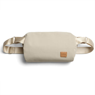 Bellroy Classic Sling 7L in beige recycled fabric with leather logo patch and adjustable straps