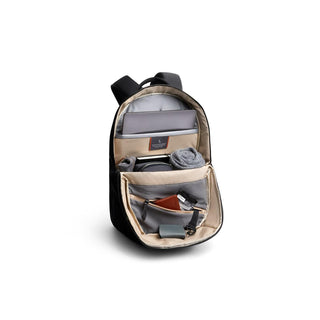 Bellroy Via Backpack open displaying organized interior pockets and compartments in black fabric