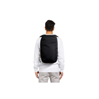 Bellroy Via Backpack in black recycled fabric worn on model’s back, showcasing slim profile design