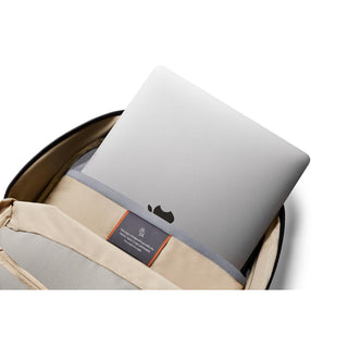 Bellroy Via Backpack with padded laptop compartment holding a silver laptop on beige lining