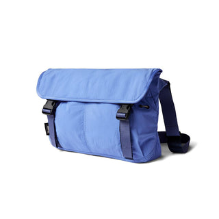 Bellroy Cinch Messenger Bag in blue with adjustable strap and weather-resistant recycled fabric