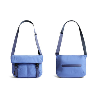 Bellroy Cinch Messenger Bag in blue recycled nylon fabric shown front and back with adjustable strap