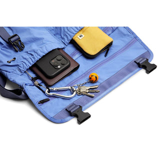 Bellroy Cinch Messenger Bag in light blue with organized inner compartments and key holder clip