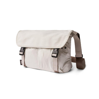 Bellroy Cinch Messenger Bag in light beige with durable recycled nylon fabric and adjustable strap