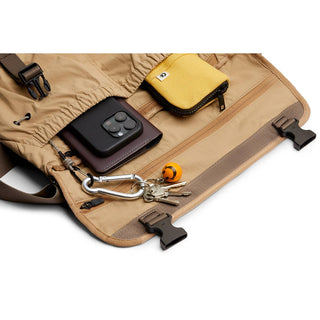 Bellroy Cinch Messenger Bag open showing organized interior with pockets and hanging keys