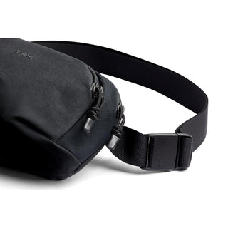 Bellroy Venture Hip Pack 1.5L in black with durable recycled fabric and adjustable buckle strap detail