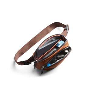 Bellroy Venture Hip Pack 1.5L in brown with adjustable strap and organized dual compartments open