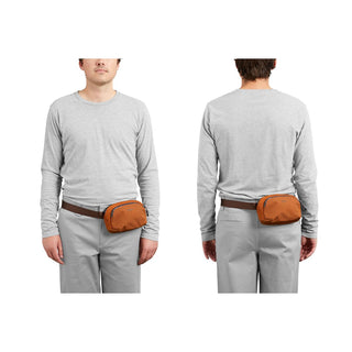 Bellroy Venture Hip Pack 1.5L in burnt orange recycled fabric worn front and back view