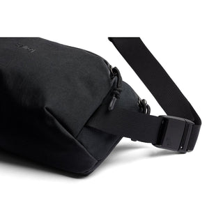 Bellroy Venture Ready Sling 2.5L in black showing durable nylon fabric and adjustable strap buckle close-up