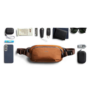 Bellroy Venture Ready Sling 2.5L in rust fabric with brown adjustable straps and compact shape