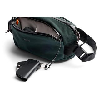 Bellroy Venture Ready Sling 2.5L in dark green with open main compartment and key holder attached