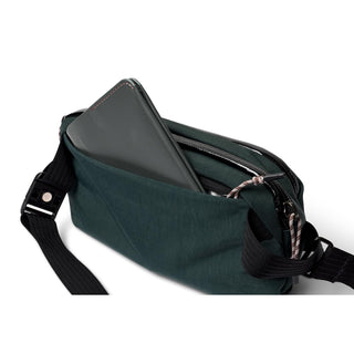 Bellroy Venture Ready Sling 2.5L in dark green with nylon fabric and black adjustable strap