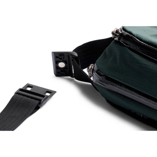 Bellroy Venture Ready Sling 2.5L showing detachable black buckle and dark green fabric textured side