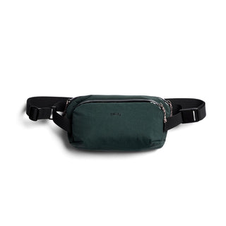 Bellroy Venture Ready Sling 2.5L in dark green with sleek recycled fabric and adjustable black strap