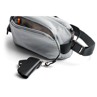 Bellroy Venture Ready Sling 2.5L in light gray with durable fabric and adjustable black strap carrying keys