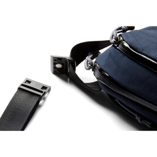 Close-up of navy Bellroy Venture Ready Sling 2.5L showing clasp and textured fabric detail