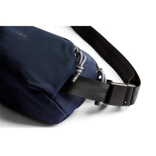 Bellroy Venture Ready Sling 2.5L in navy blue with durable zippered compartments and adjustable black strap close-up