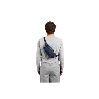 Bellroy Venture Ready Sling 2.5L worn on back in navy blue recycled fabric crossbody bag