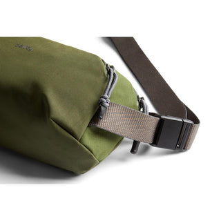 Bellroy Venture Ready Sling 2.5L in olive green with adjustable brown strap and durable recycled fabric