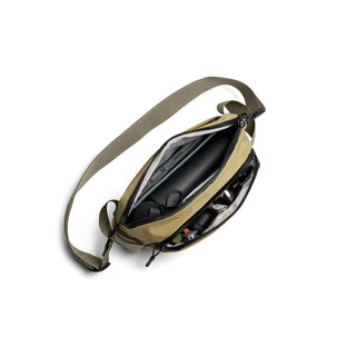 Bellroy Venture Ready Sling 2.5L in olive green showing organized interior compartments and adjustable strap