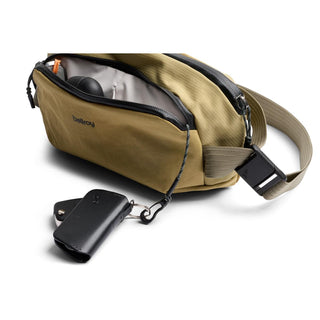 Bellroy Venture Ready Sling 2.5L in olive green with zippered main compartment and detachable key clip