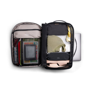 Bellroy Lite Travel Pack 30L open showing organized interior with clothes, tech, and packing accessories