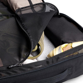 Bellroy Lite Travel Pack 30L open with mesh compartment showing packed clothes and accessories inside